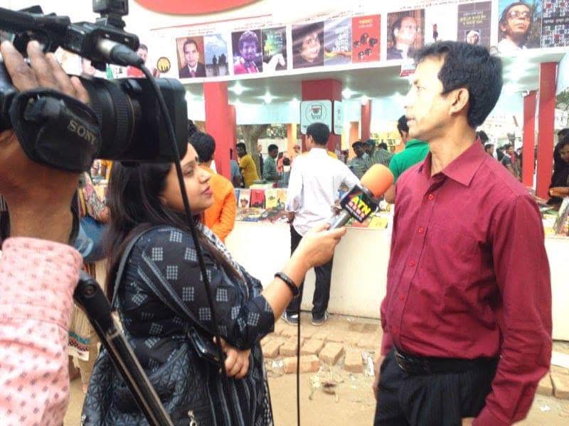 I am giving an interview to ATN NEWS at the Amar Ekushey Book Fair.
