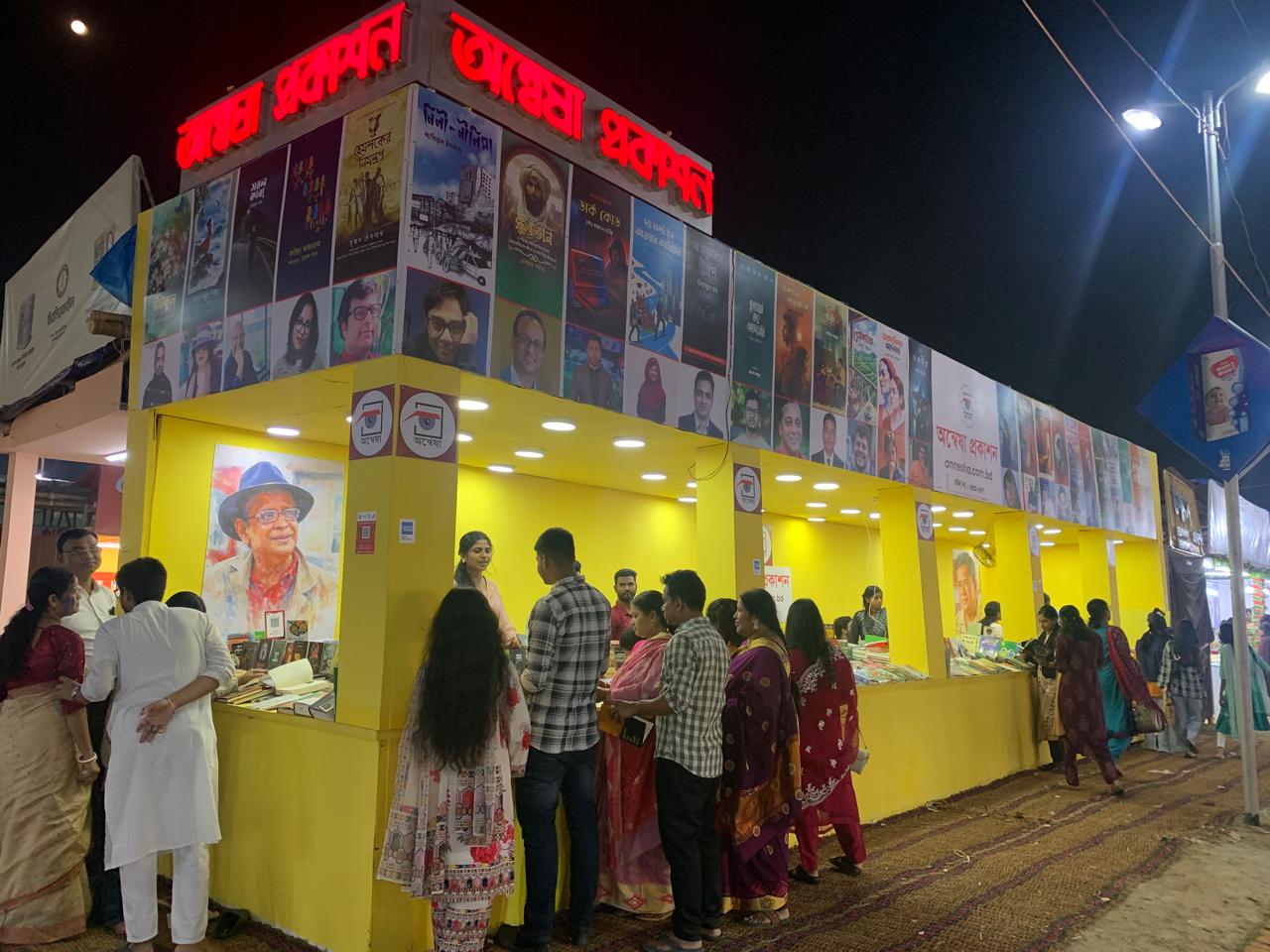 At the Amar Ekushey Book Fair 2026, enthusiastic readers are actively purchasing books at the Annesha Prokashon stall.